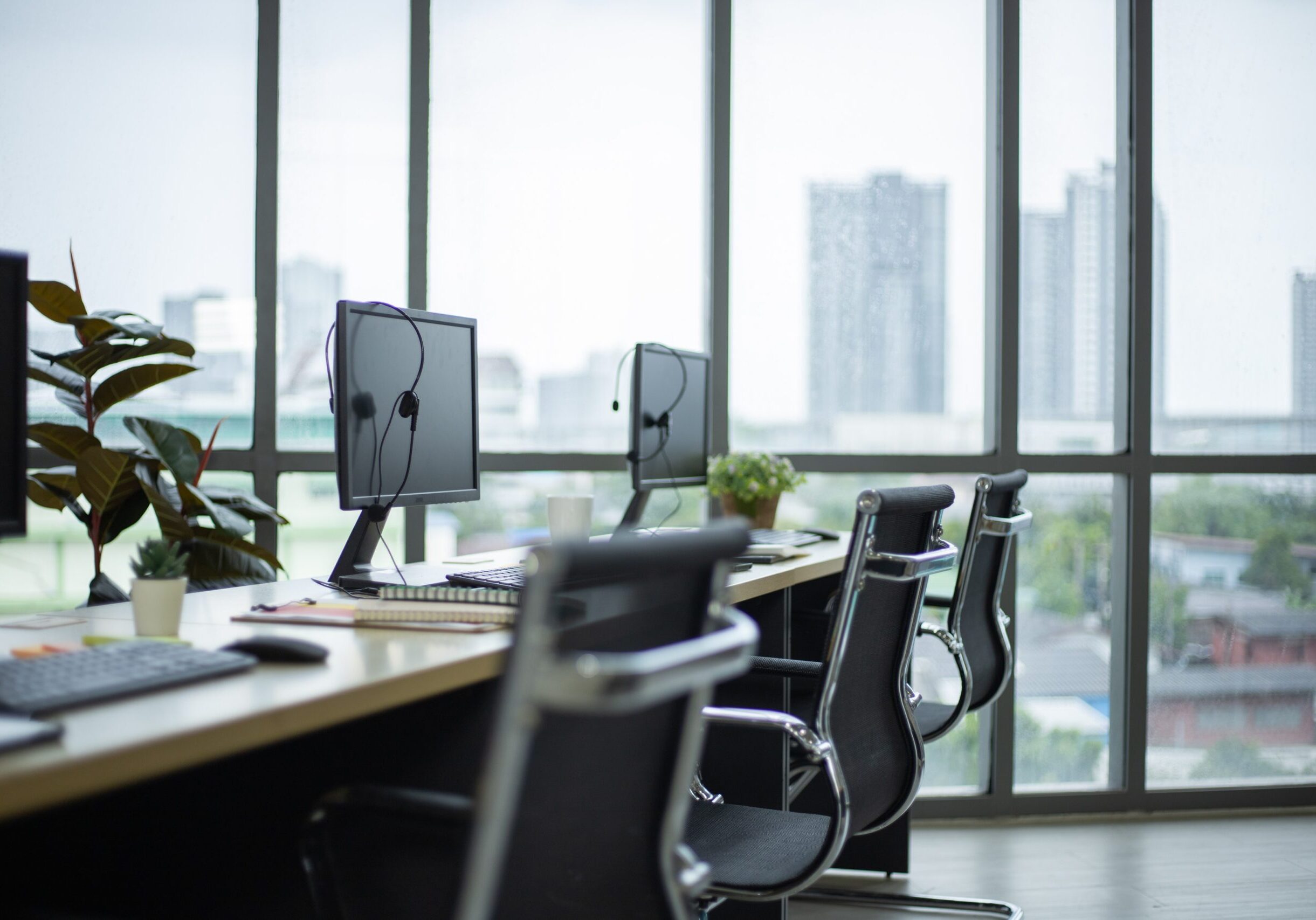 vecteezy_side-view-of-computers-and-headset-on-desk-at-call-center-training-center_3023621 (1)